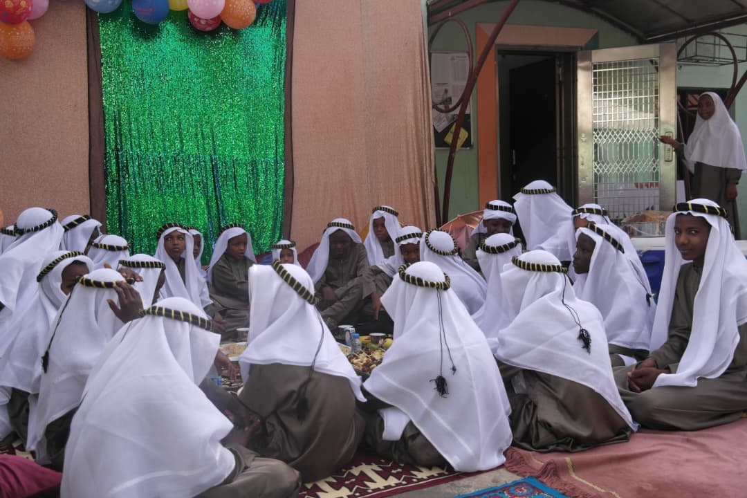 Students in traditional Arabian attire gathered for a cultural celebration