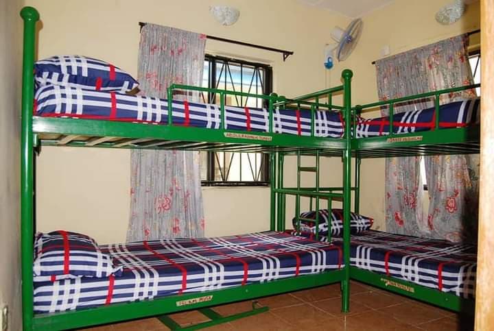 Clean and tidy boarding dormitory with bunk beds for resident students